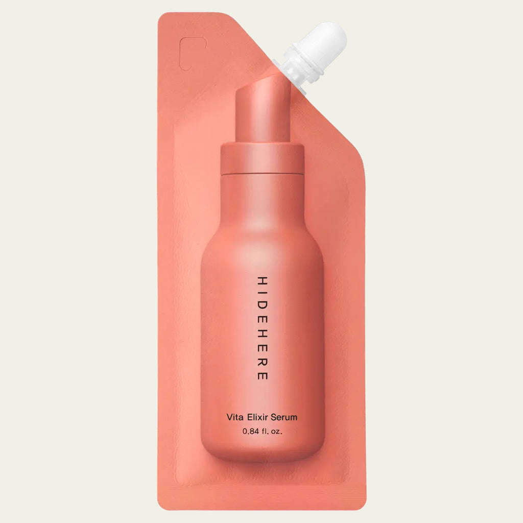 Hidehere Vita Elixir Serum 25 ml, sérum facial iluminador con vitaminas en envase flexible con boquilla